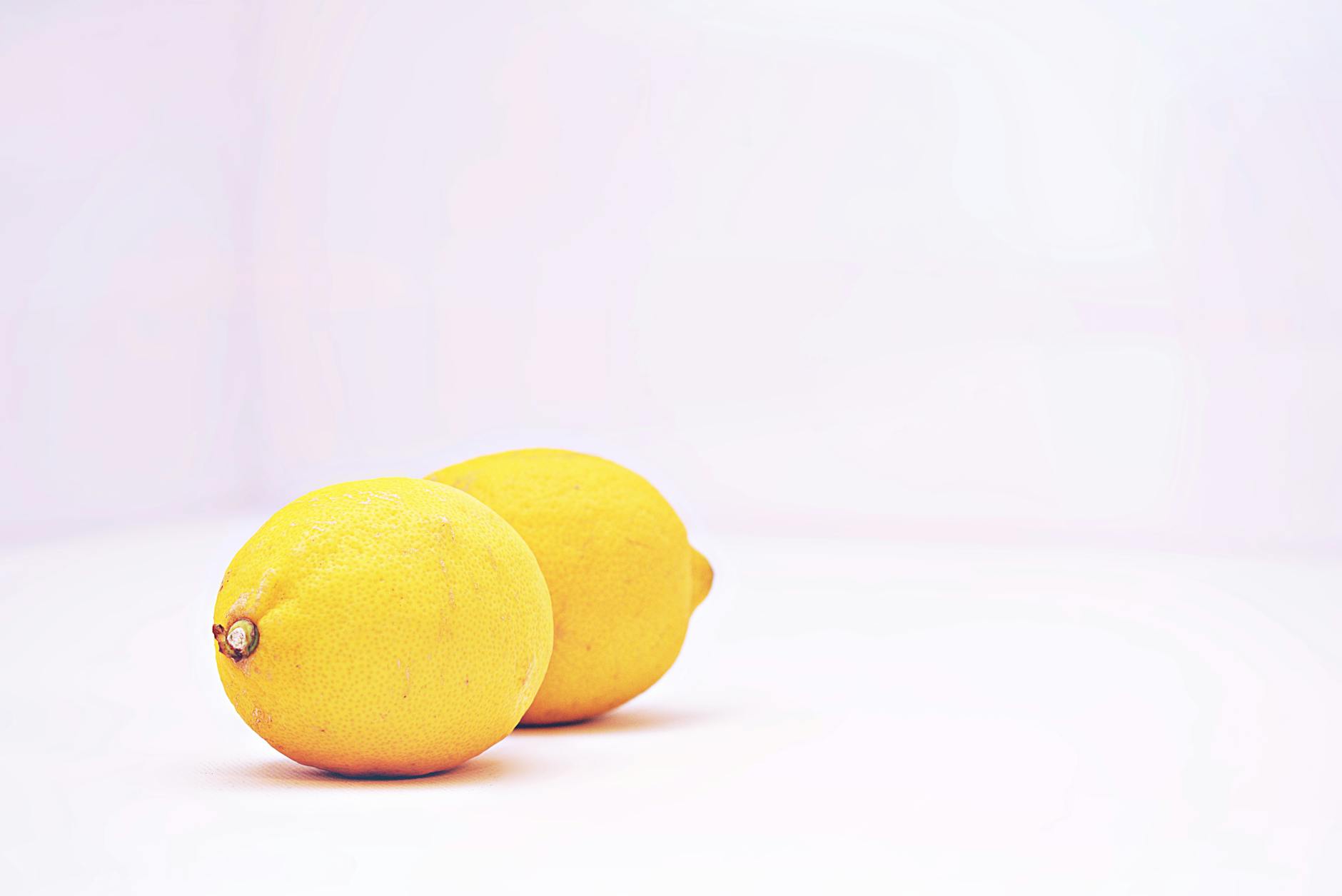 Woman holding lemon vibrator with focused, calm expression